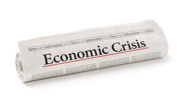 Rolled newspaper with the headline Economic Crisis