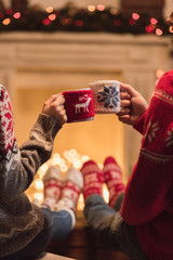 couple with cups at christmastime