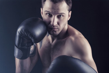 Fototapeta na wymiar Man in boxing gloves