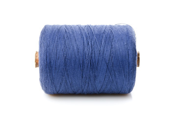 bobbin with blue thread isolated on a white background