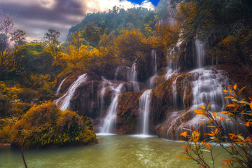 Fototapeta na wymiar beautiful autumn waterfall in Thailand.