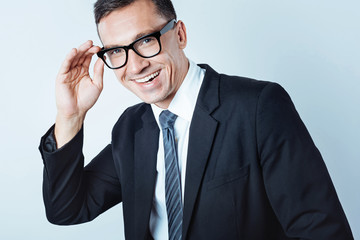 Excited man of business posing in glasses