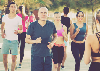 People running along embankment