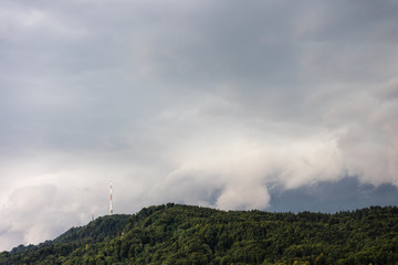 stormy cloud over uetliberg mountain in zurich switzerland with tv tower