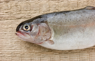 rainbow trout on a wooden board