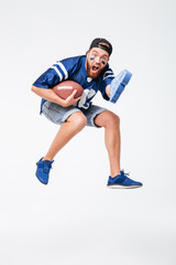 Screaming man fan in blue t-shirt jumping isolated