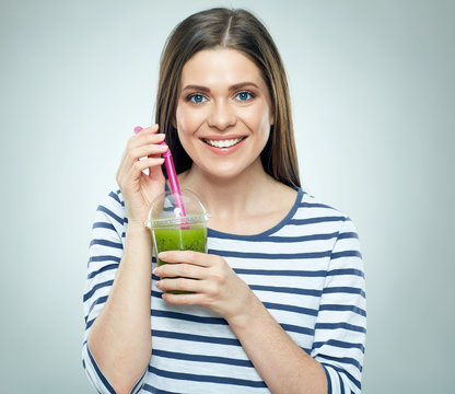 Smiling woman holding sport cocktail in glass