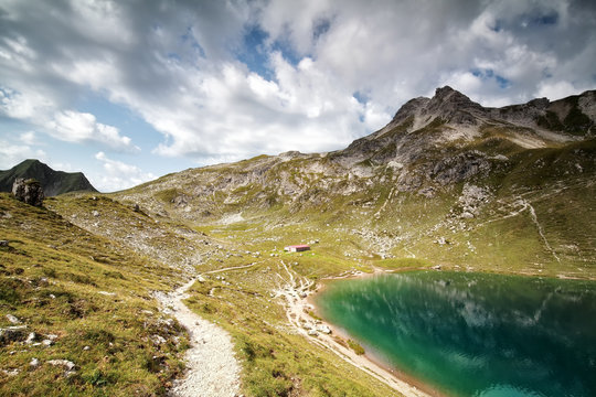 turquoise alpine lake in summer