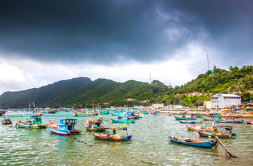 Fototapeta na wymiar NAM DU, VIETNAM - JULY 27, 2017: Boats in Hon Tre pier, early morning, Nam Du Islands, Kien Giang, Vietnam