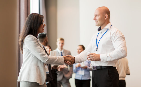 handshake of people at business conference