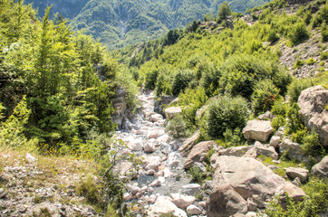 Fototapeta na wymiar River in Theth mountains, Albania.