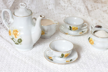 Tea set on white table