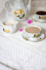 Fototapeta na wymiar milk and cup of coffee on white table