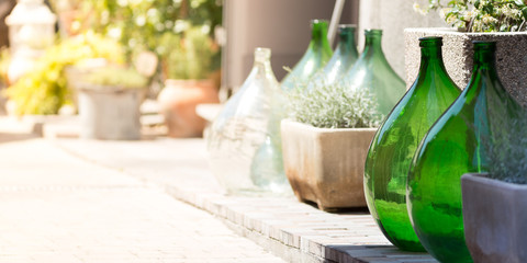 Green glass jars on sale in Italy