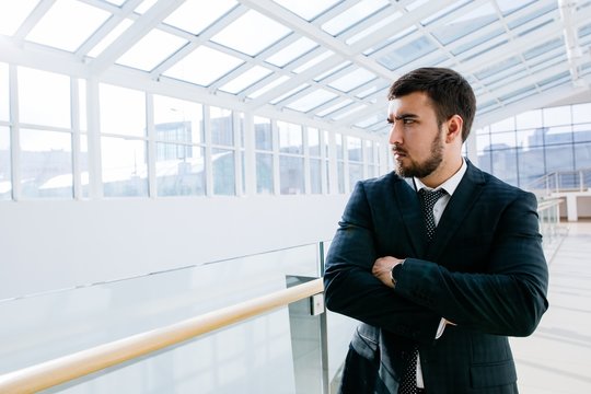businessman looking to the side window