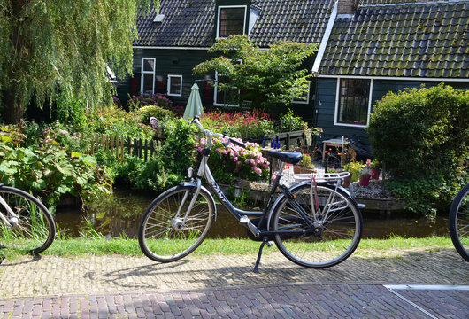 Park in the Zaandam. Bicycle on the background of old houses
