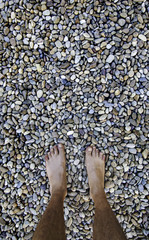 Barefoot feet on a stones