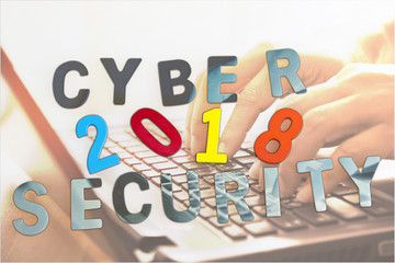 Cyber security concept and Trends 2018 with laptop in background.