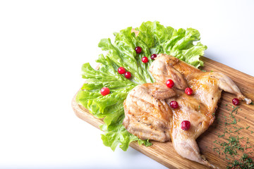 Roasted Quail with  cowberry   on a white