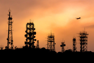 many type of communication towers  with airplane