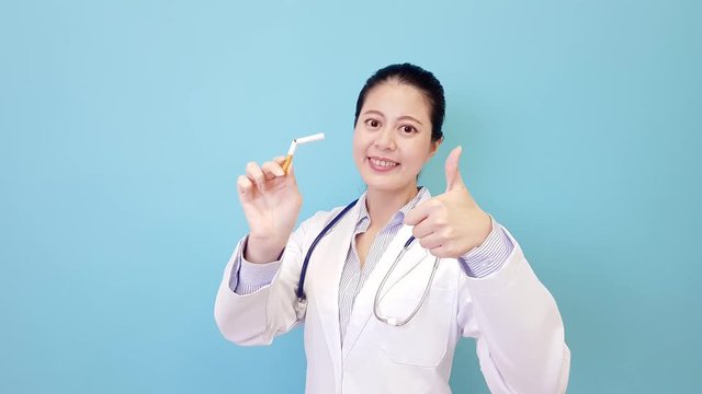 female hospital doctor showing thumb up gesture
