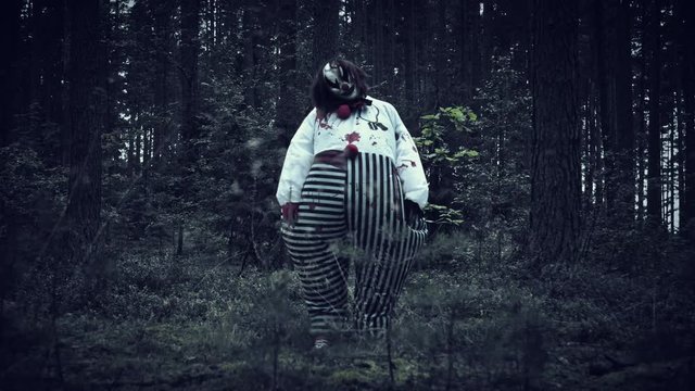 4K Halloween Horror Clown in Forest Standing Weird