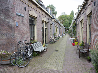 narrow street with small houses in centre of dutch town utrecht in holland