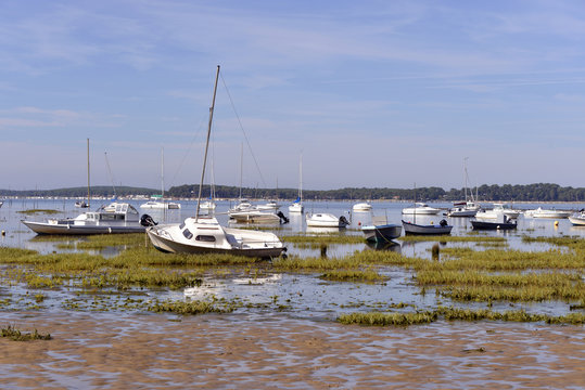 Boats at low tide at Arès, ostreicole commune located on shore of Arcachon Bay, in the Gironde department in southwestern France.