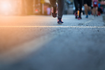 Blurred Legs of people on marathon running. Run for health.