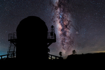 Fototapeta na wymiar observatory with milky way galaxy, long exposure photograph, with grain