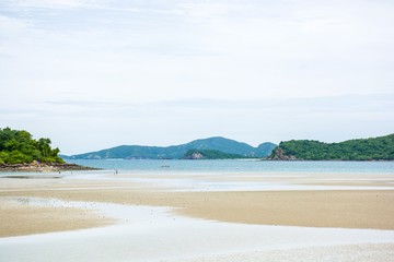Blue sky and the mountains with the beach at Toei Ngam Beach, Chonburi, Thailand.