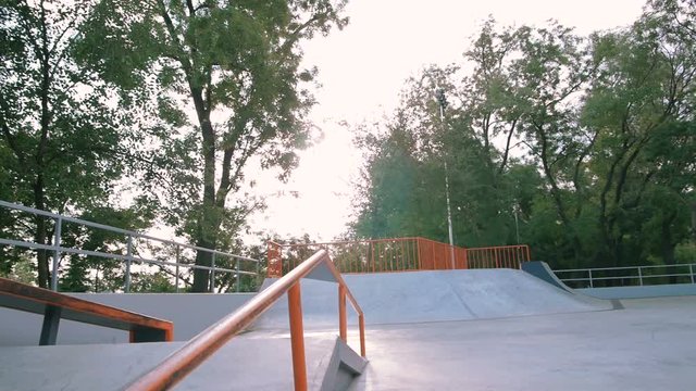 Young man doing parkour tricks in extreme sports park