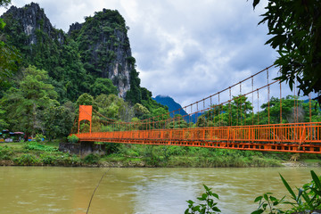 orange bridge and river in Vang Vieng Lao