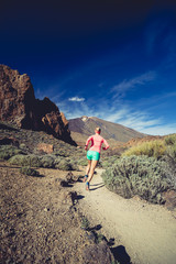 Fototapeta premium Trail running girl in mountains, inspiration and motivation