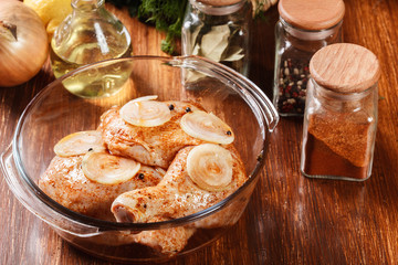 Raw chicken legs marinated