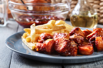 Traditional German currywurst - pieces of sausage with curry sauce