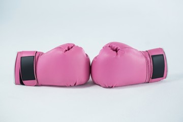 Close-up pair of pink boxing gloves