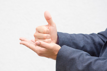 Close up hands of a male public speaker while giving a speech. 