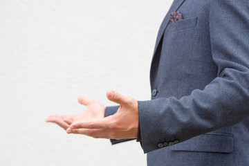 Close up hands of a male public speaker while giving a speech. 