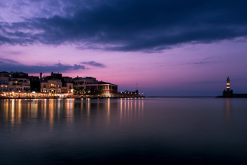 Chania, Crete, Greece: lighthouse in Venetian harbor at blue hour