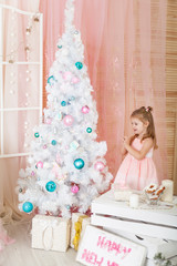 Fototapeta na wymiar Cute girl in a Christmas decorations
