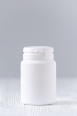 mock up plastic bottle for medicine, powder, pills, tabs, capsules, selective focus