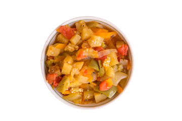 Stew from aubergines, tomatoes, onions, carrots and peppers on the white background. Isolated