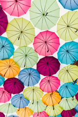 Fototapeta na wymiar Colorful umbrellas in the sky background, Street decoration