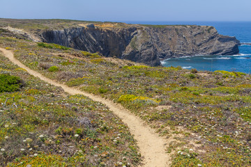 Trail, Cliffs, beach and waves in Arrifana