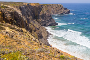 Cliffs, beach and waves in Arrifana