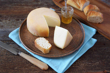 Cheese, baguette and honey