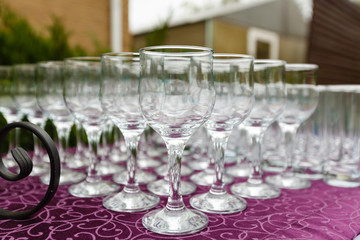 Beautiful champagne glasses defocused on buffet table in restaurant and blurred background