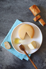 French cheese, baguette and honey. Top view