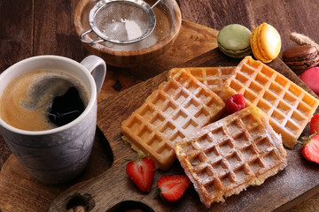 Belgian waffles with strawberries and raspberries, homemade healthy breakfast with coffee